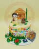 One-tier birthday cake with Filipino heritage theme, featuring a girl, nipa hut, carabao, and Raphaela Elizabeth banner in yellow and green.