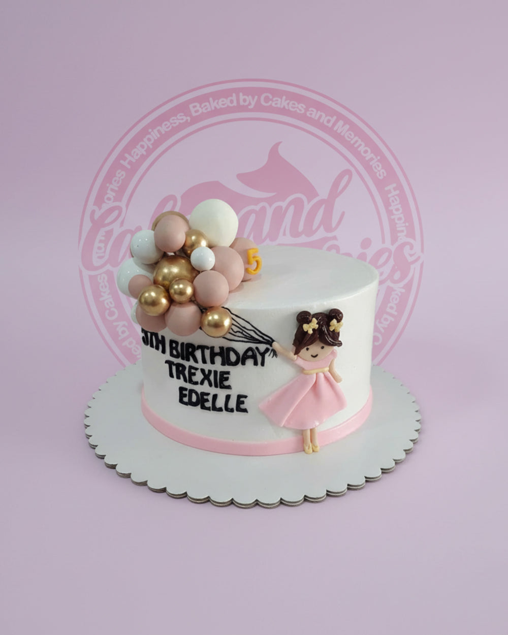 One-tier custom birthday cake with fondant girl holding gold, rose gold, and white balloons, and '5TH BIRTHDAY TREXIE EDELLE' text.