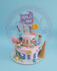 Two-tier Roblox birthday cake with pink/blue icing, gold drip, Roblox characters, candies, Lego bricks, 