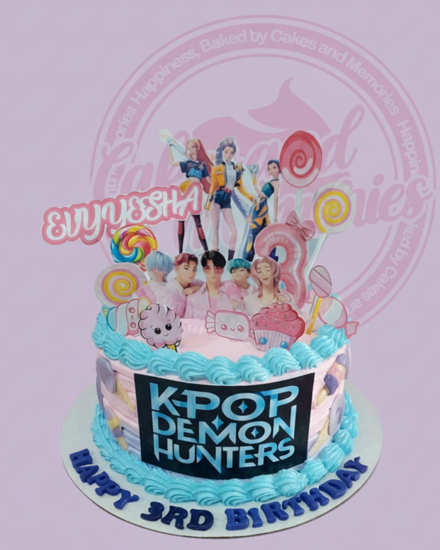One-tier K-Pop Demon Hunters birthday cake with pink and blue buttercream, anime figures, lollipops, and "EVYYSSHA 3RD BIRTHDAY" text.