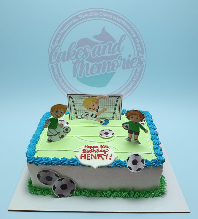 One-tier soccer birthday cake with green field, blue border, and cartoon soccer player printouts for Henry's 10th birthday.