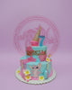 Two-tier Lilo & Stitch Angel birthday cake for Isabella, age 7, with light blue and pink icing, gold letters, and tropical flowers.
