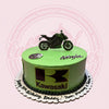 Round 1-tier custom birthday cake with Kawasaki Ninja motorcycle, logo, and '30th Birthday Daddy' text in green and black.