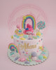 One-tier My Melody birthday cake with a pastel rainbow, candies, macarons, and 