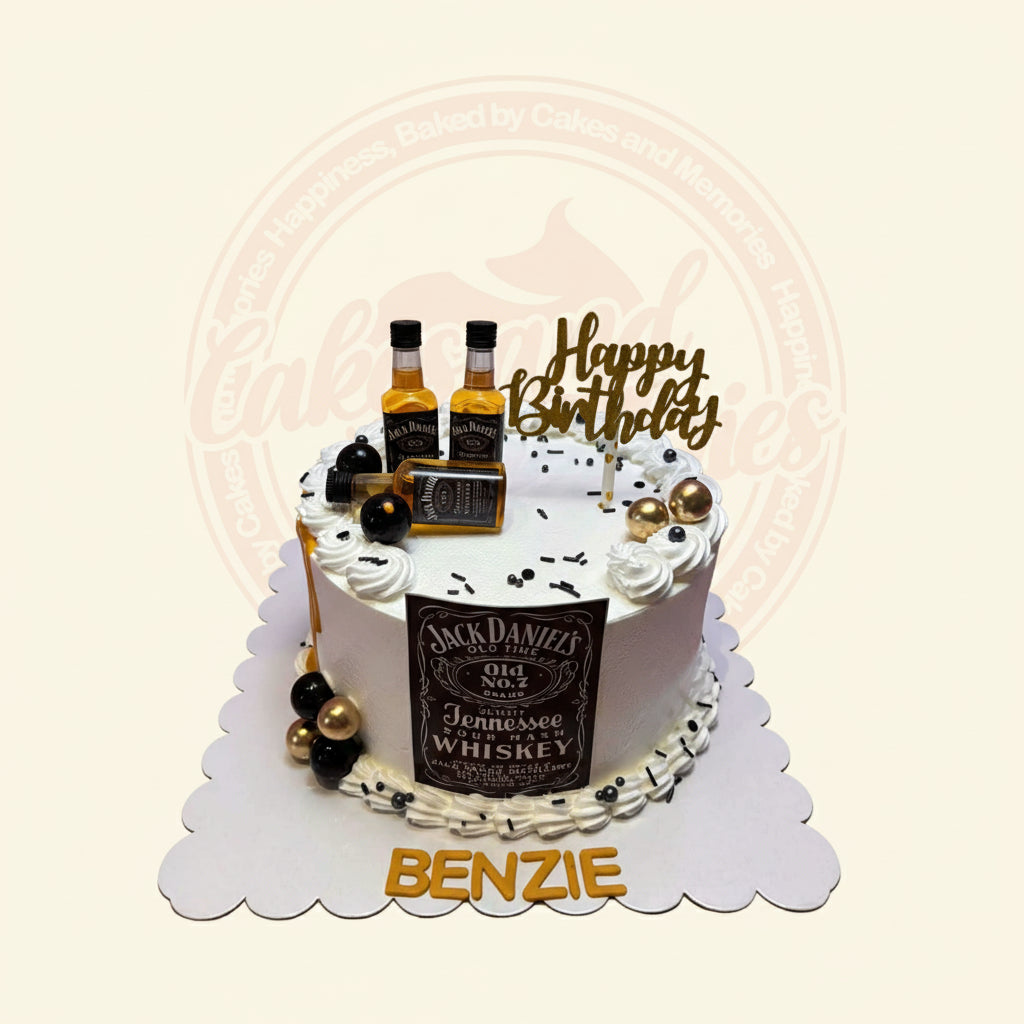 One-tier Jack Daniel's whiskey themed birthday cake with white buttercream, mini bottles, gold drip, sprinkles, and 'BENZIE' name.