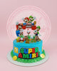 One-tier Super Mario birthday cake with Mario, Luigi, Goombas, Piranha Plants, and 'HAPPY 2ND BIRTHDAY AMIRI!' in blue and green.