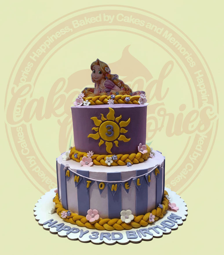 Two-tier Rapunzel Tangled birthday cake with purple and lavender stripes, golden sun with '3', 'Antonella', and 'Happy 3rd Birthday'.