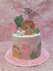 This charming dinosaur cake is adorned with pink icing and features adorable dinosaur printout toppers, perfect for celebrating Sapphira Adeline's 3rd birthday. Nestled among colorful eggs and leaves, this one-tier cake captures a delightful dinosaur theme.