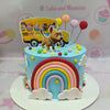 This vibrant Cocomelon cake features a playful blue design with a cheerful yellow bus, colorful balloons, and an adorable dog, perfect for a baby's first birthday celebration. The customized printout toppers highlight the 