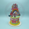One-tier My Little Pony 1st birthday cake with rainbow, character toppers, and 'Maria Ariella & Maria Aliza' banner in pastel colors.