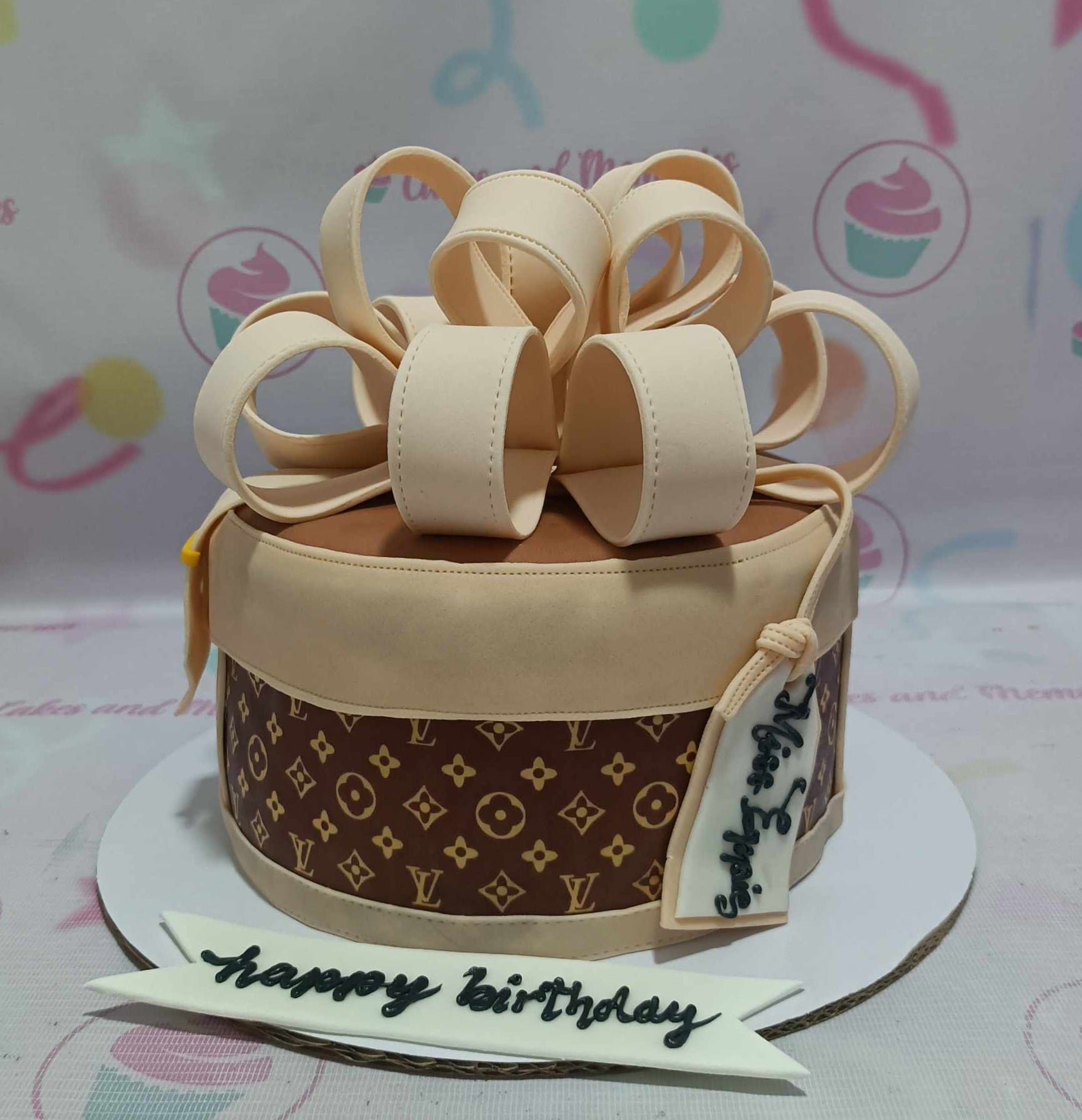 This stunning Louis Vuitton Cake features a luxurious brown fondant design adorned with intricate details of designer bags like Chanel, Gucci, and Michael Kors. Perfect for the girlboss CEO, this one-tier masterpiece showcases the essence of luxury in a playful and elegant way.