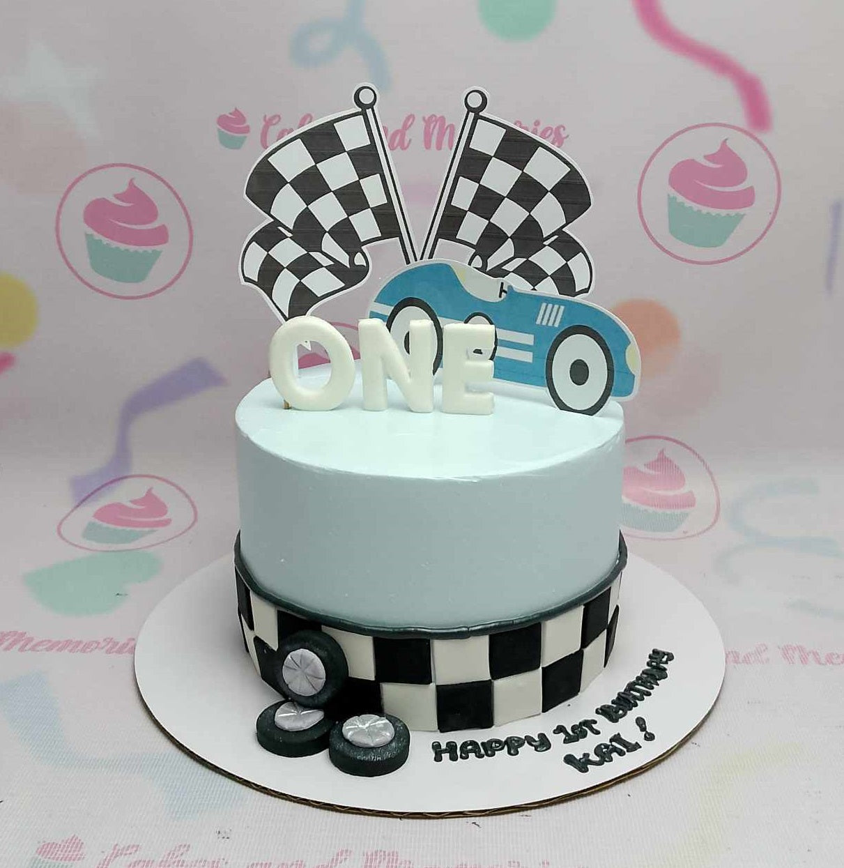 Celebrate your little one's 1st birthday with our vibrant blue Wheels Cake, perfectly adorned with a checkered flag motif and racing details, ideal for car enthusiasts and dads alike! This custom 1-tier design featuring Ferrari and Lamborghini elements is sure to delight every gentleman in the family, making it a perfect centerpiece for any birthday celebration.