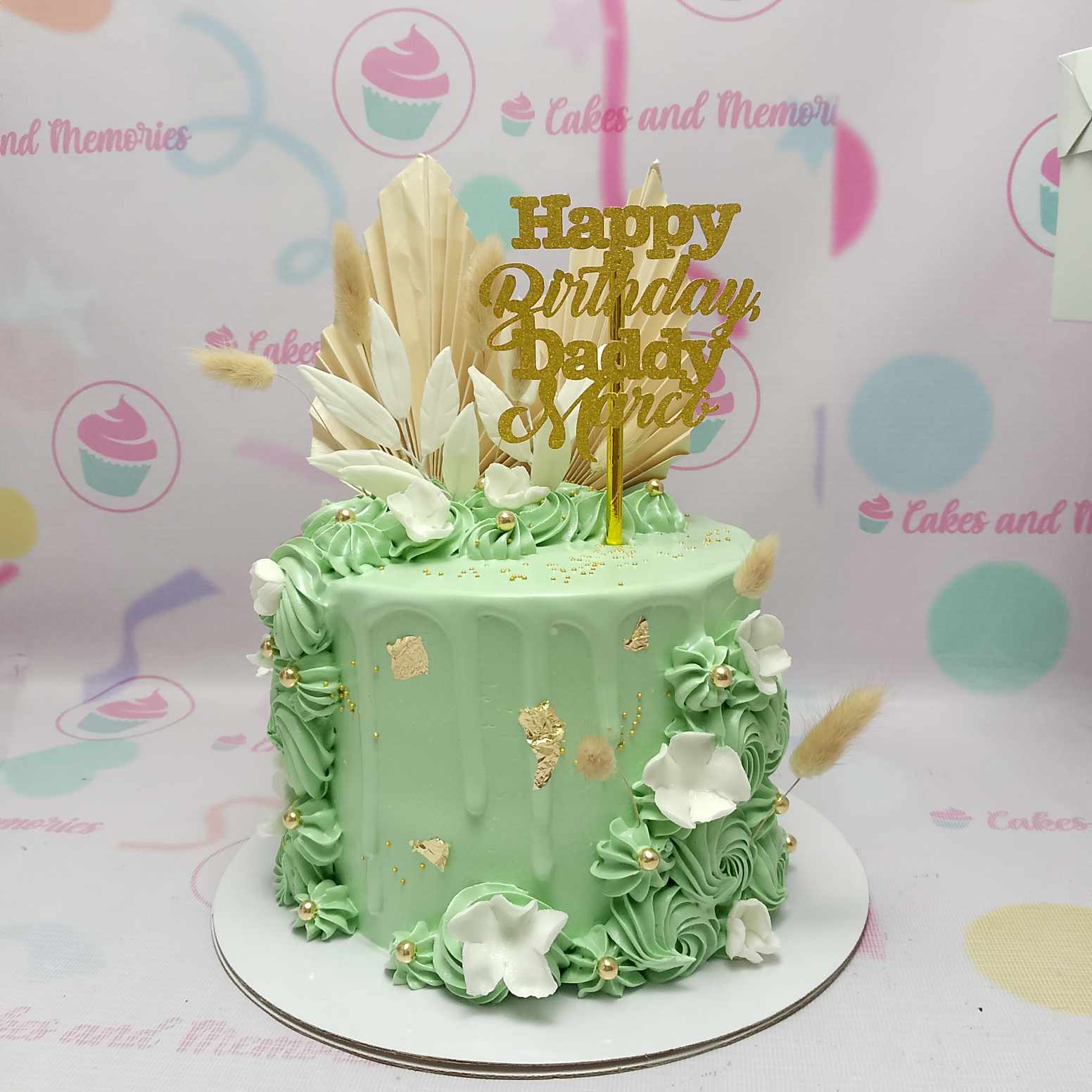 This stunning mint green drip cake features elegant light green drips and a luxurious gold laser-cut topper, making it the perfect centerpiece for an 18th birthday celebration. A beautifully crafted 1-tier masterpiece, it's sure to impress at any event.