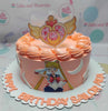 This stunning Sailor Moon Cake features a vibrant peach and pink design, showcasing beloved characters from the anime and manga, including Sailor Moon and Tuxedo Mask, adorned with colorful printout toppers. Perfect for celebrating girl power, this one-tier, one-layer treat is a must-have for any fan!