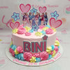 Introducing the stunning Bini Cake, a delightful 1-tier creation adorned with pastel pink and blue hues, featuring charming hearts and vibrant blooms that perfectly capture the essence of Ppop and Kpop. This colorful centerpiece is ideal for any celebration!