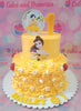 The Belle Cake features a vibrant yellow design inspired by Beauty and the Beast, perfect for a 1st birthday celebration. This whimsical two-tier cake showcases Belle in her iconic ball dress, adorned with delightful printout toppers for a truly magical touch.