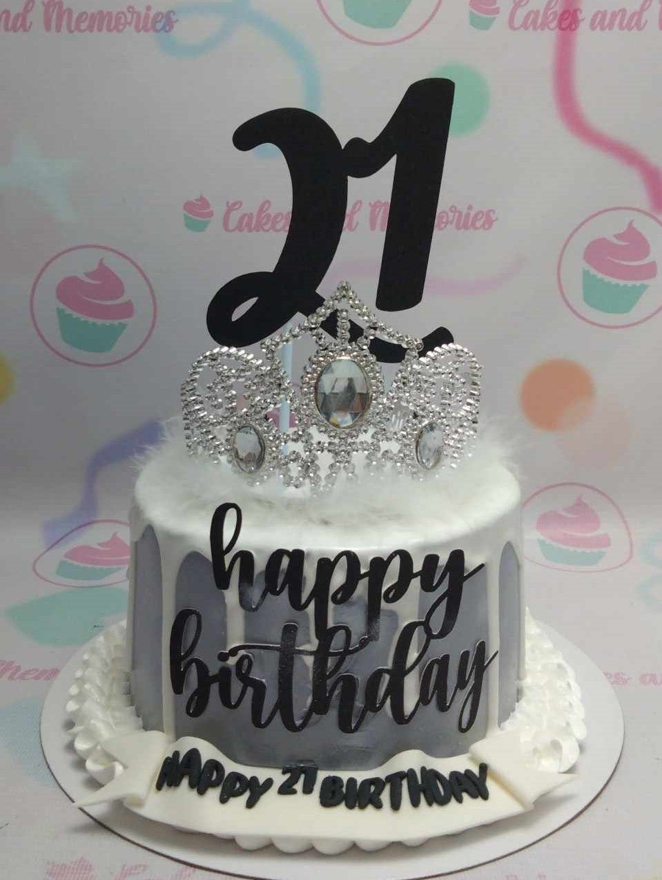 Introducing our stunning Crown Cake, designed in elegant shades of silver, gray, and black, perfect for celebrating your little princess or queen. This one-tier masterpiece features a dazzling silver crown, making it an ideal choice for a royal 1st birthday celebration.