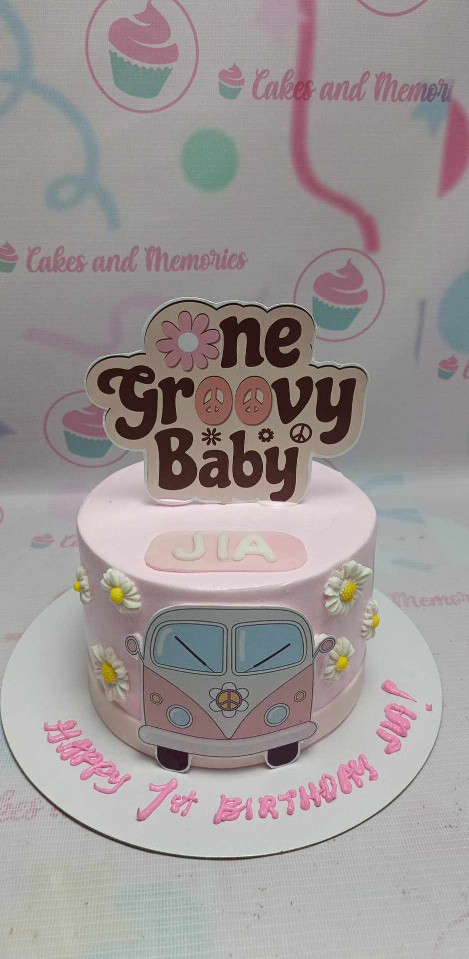 Celebrate your little one’s first birthday with our enchanting Groovy Cake, featuring a delightful pink design adorned with charming daisies and a playful "One Groovy Baby" theme. Perfectly capturing the 70s vibe, this one-tier cake showcases a whimsical Volkswagen microbus van, making it an unforgettable centerpiece for your celebration.