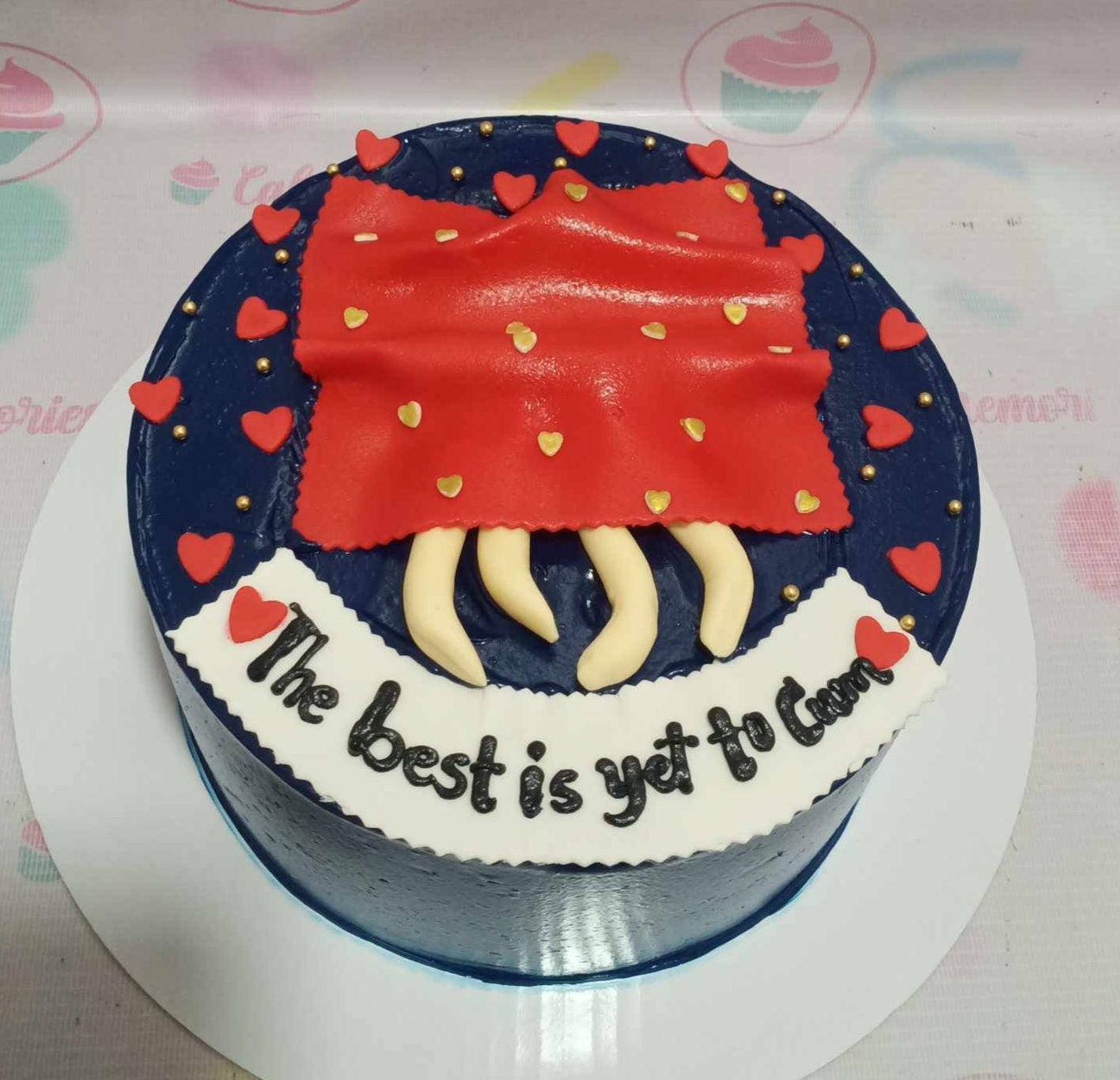 This custom Naughty Cake features a striking navy blue and red design, adorned with playful elements like boobies and butts, along with the cheeky phrase "the best is yet to cum." Perfect for adult birthday celebrations, this single-tier creation is a fun and flirty addition to any party.