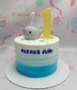 This Under the Sea Cake features a stunning blue ombre design with a cute whale and 