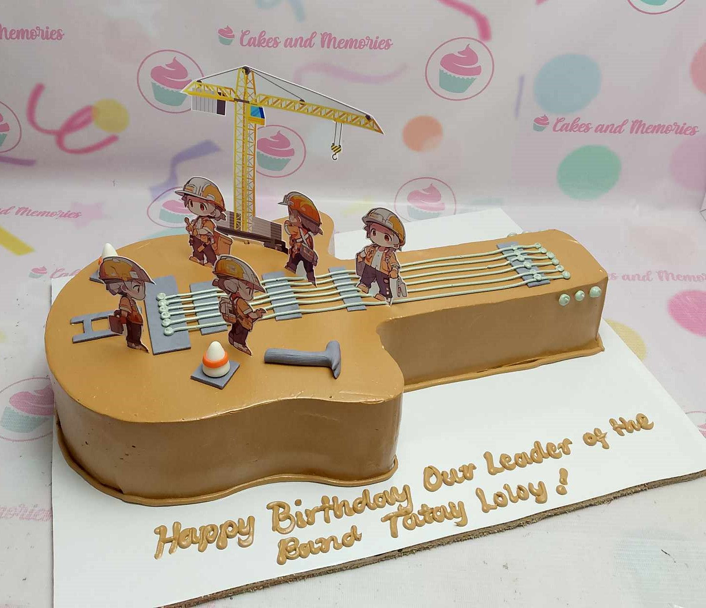 Celebrate a rock and roll birthday with this customized rectangular Music Cake featuring a striking electric guitar and construction-themed elements like a crane and workers. Perfect for musicians and college students alike, this uniquely designed cake captures the spirit of learning and fun in every slice.