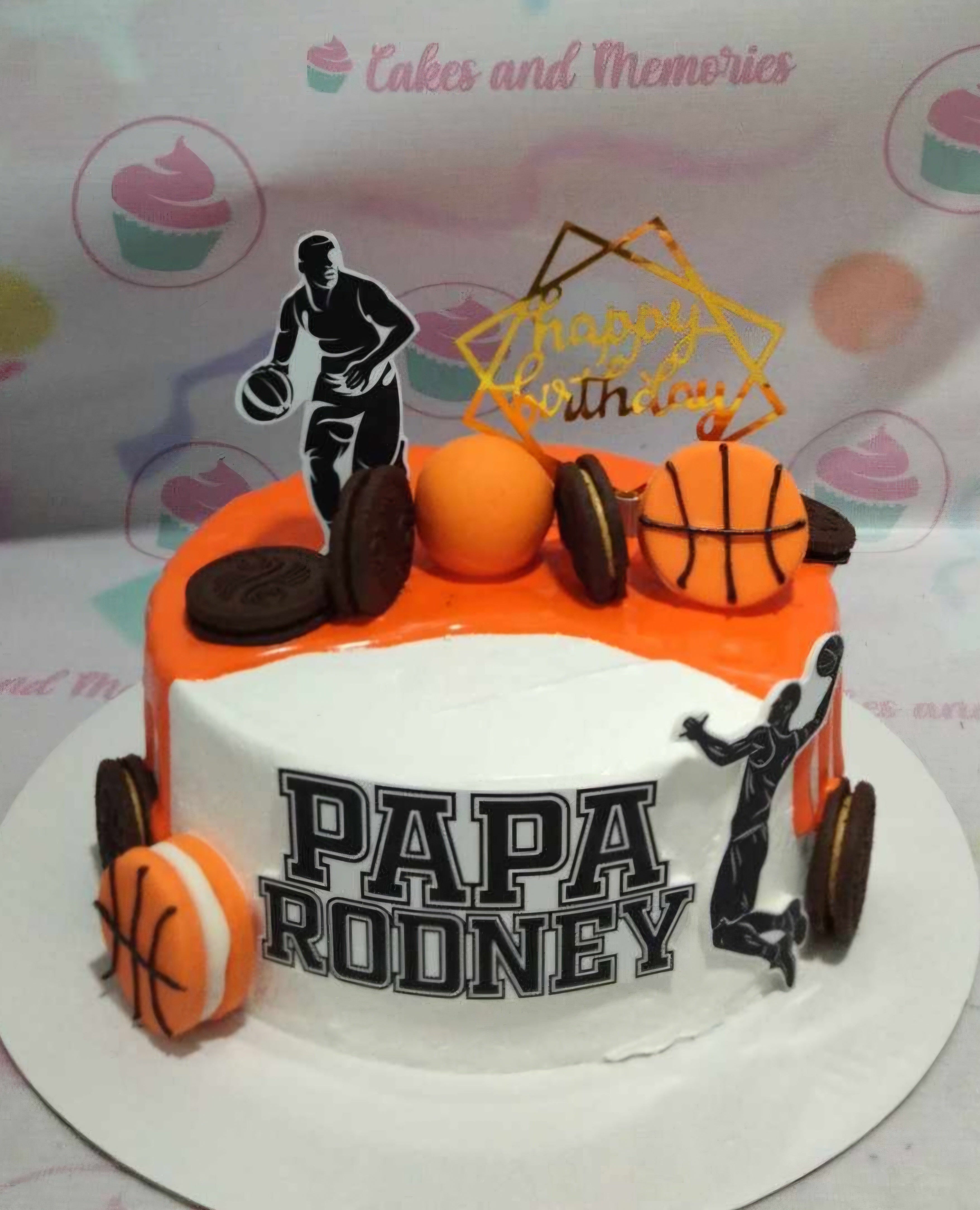 This vibrant 1-tier Basketball Cake features a striking white and orange design, perfect for celebrating the birthday of a young athlete. Adorned with printout toppers of a dunking basketball player, it's an ideal customized cake for sports-loving kids, dads, or gentlemen.