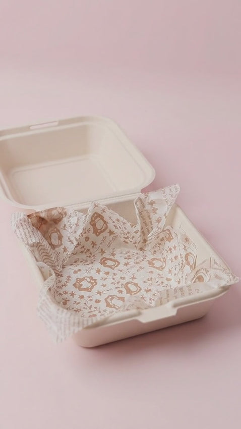 A bento cake with white icing, a photo topper, and the number 25 in colorful lettering.