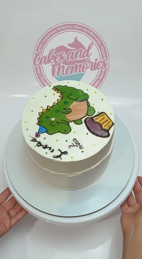 Dinosaur 2nd birthday 1-tier cake with hand-painted green dinosaur and custom name lettering