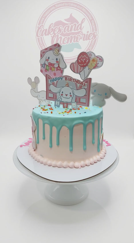 Cinnamoroll themed birthday cake with light blue drip and cute character toppers