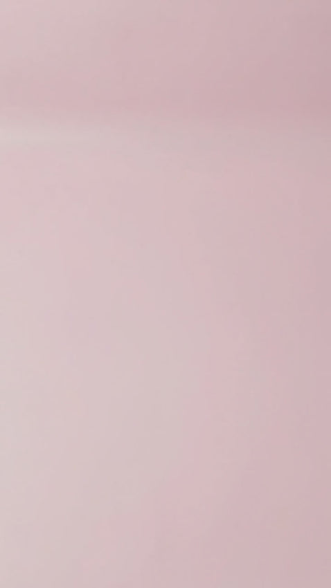 A single-tier purple cake decorated with a white October calendar design highlighting the 23rd and a Happy Birthday message.
