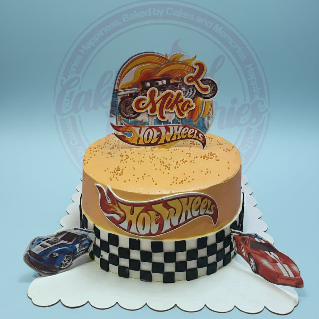 One-tier Hot Wheels birthday cake for Miko's 2nd birthday, orange with checkered flag, car cutouts, and custom topper.