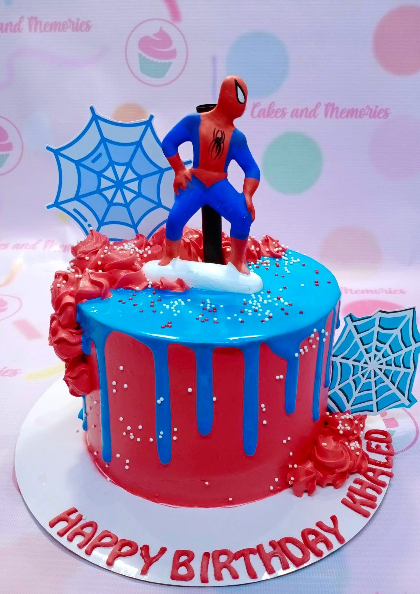 This Spiderman cake is sure to win the hearts of the little superhero in your life. It features a classic blue and red icing with a detailed blue spider web and Spiderman printouts. Perfect for any birthday celebration or Avengers fan! This high quality, custom designed cake is sure to be the showstopper of the party.