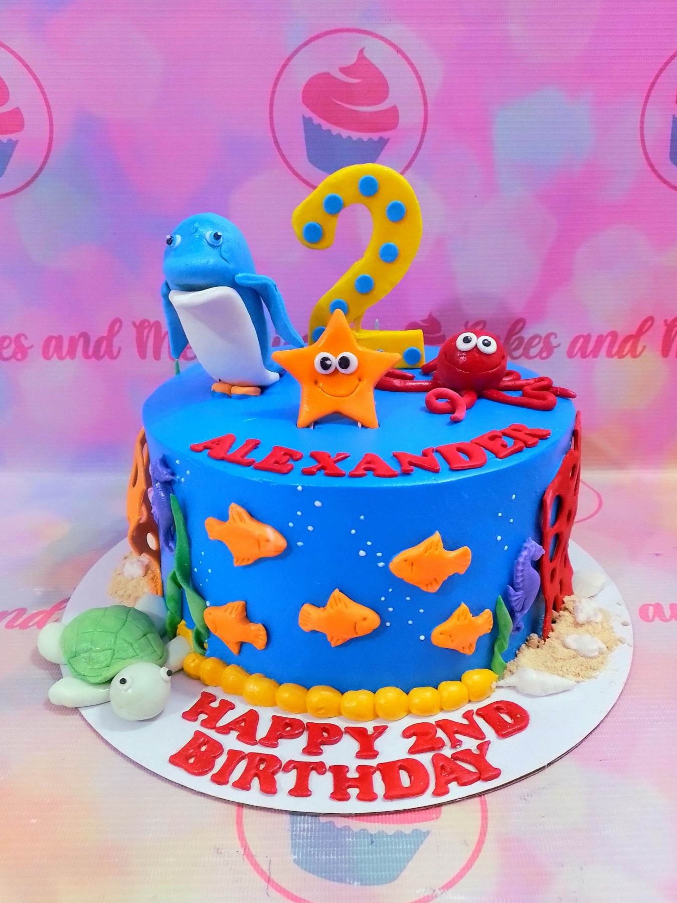 This delightful Under the Sea Cake is the perfect centerpiece for your little girl's birthday party. It is custom-decorated with ocean blue frosting and accented with perfect details like starfish, dolphins, crabs, and lobsters. It will be sure to bring a cheerful atmosphere to your special occasion.