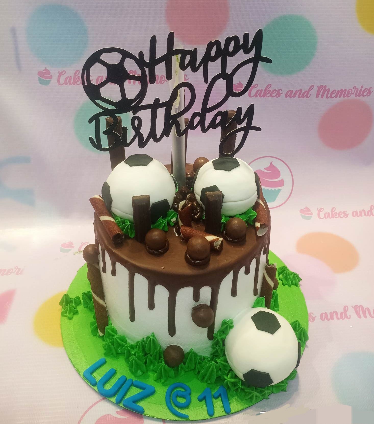 This custom decorated Soccer Cake is an ideal cake for birthdays and special occasions. With its green frosting, brown grass-like texture, and a realistic soccer ball, it is sure to make an impression. Delicately crafted with the utmost quality, this cake is sure to impress.