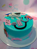 This delightful custom decorated cake is perfect for a traveler's special birthday. It features a colorful design of airplanes, passports, and countries, with shades of blue, green and teal. Perfectly topped with a 
