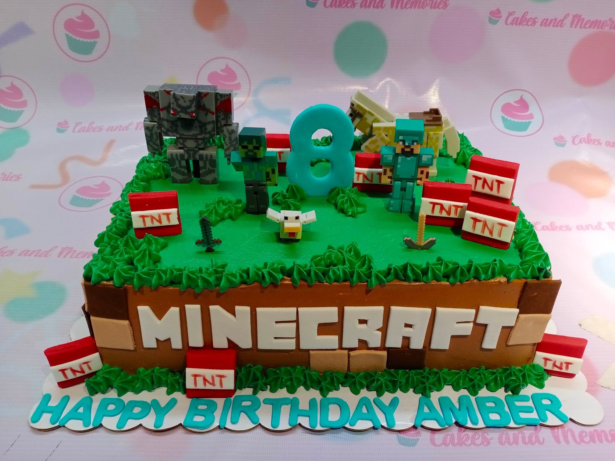 This custom decorated Minecraft cake is a must-have for any videogames fan and children's birthday party! It is decorated with an intricate combination of green and brown blocks, perfect for immersing any online gamers into the world of Minecraft. Get your customized cake from us today, with toys as add-ons!