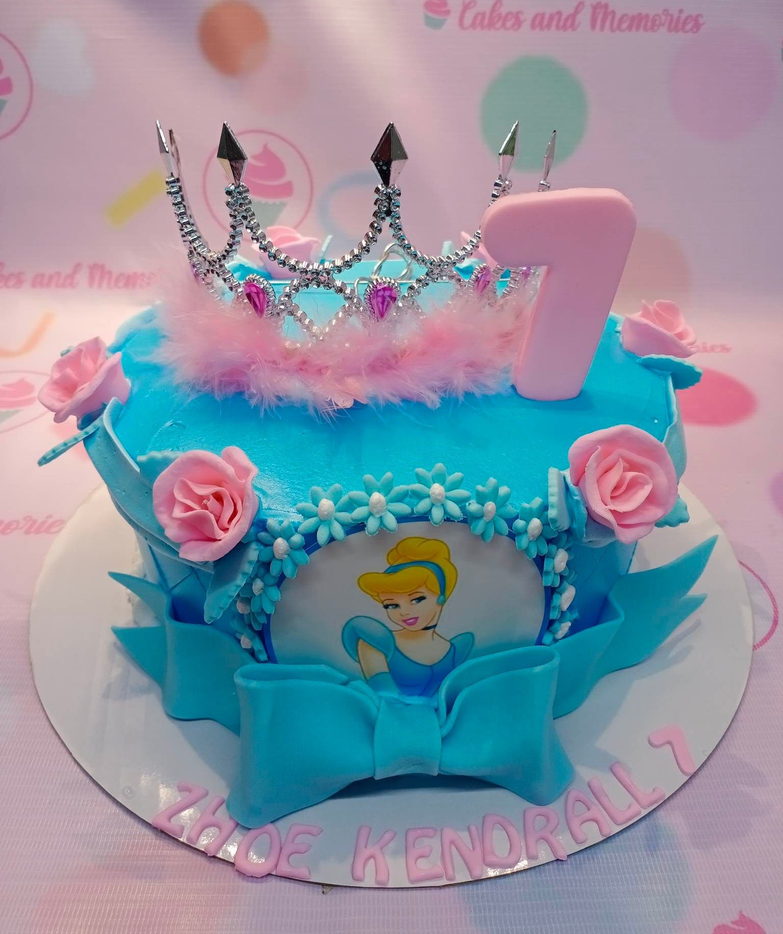 This beautiful Cinderella-themed cake is an excellent choice for any baby's 7th birthday. Its soft blue and pink color scheme and intricate crown topping give it a cute and elegant look, perfect for the special Disney Princess in your life. This custom-made cake is guaranteed to bring a wonderful surprise to your little one's special day.