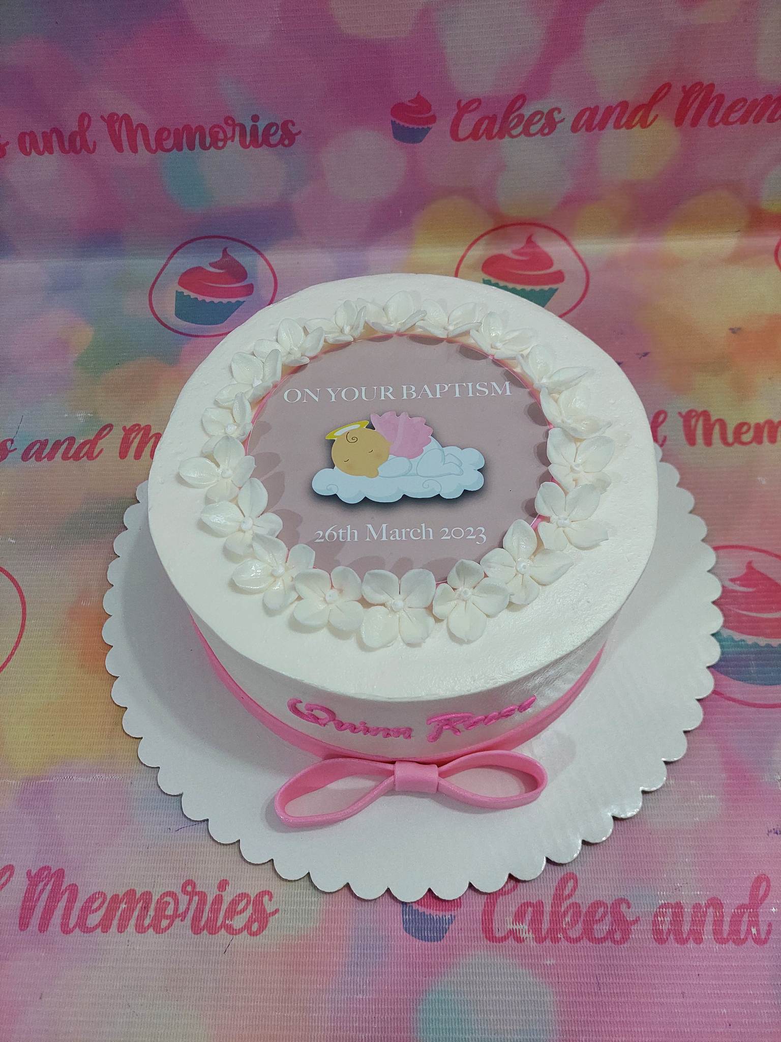 This beautiful Christening Girl Cake is sure to make an impression. Decorated with a pink sleeping baby, it is perfect for a christening or baptismal. Made with the highest quality ingredients, this customized cake is a unique and special way to celebrate a birthday or special occasion.
