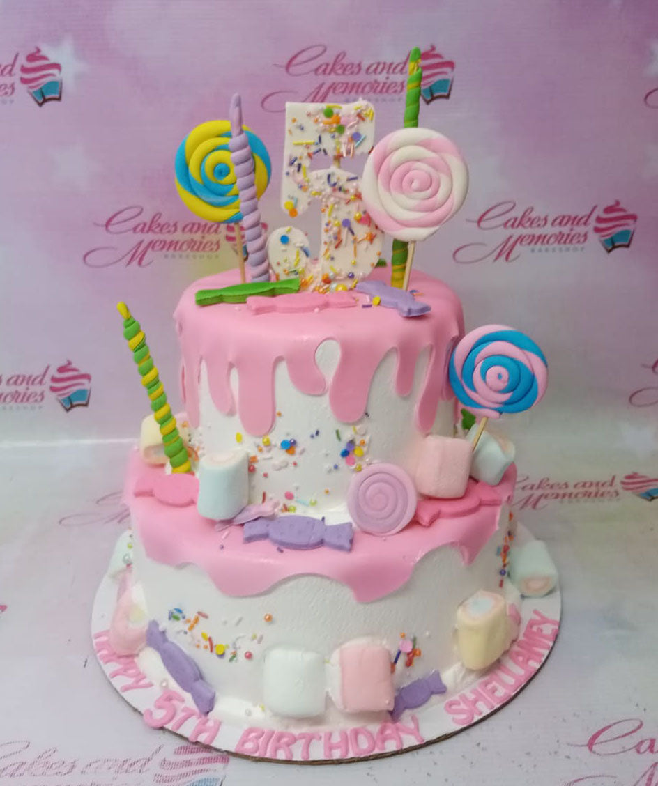 Mermaid theme candyland cake with glitter tails, shells and sea creatures.  Stock Photo by ©amarosy 226842376