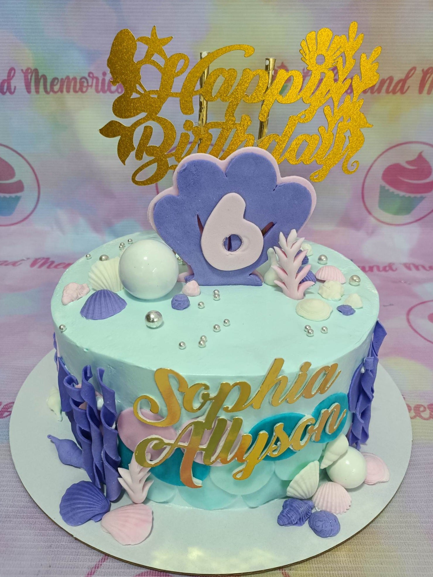 This beautiful Under the Sea Cake is perfect for any birthday celebration! It is decorated with blue, purple, and gold seashells, a mermaid and gold money coins, making the cake look like a treasure chest. It is perfect for children, and can be customized to any age or gender. It is especially popular with little mermaid fans!
