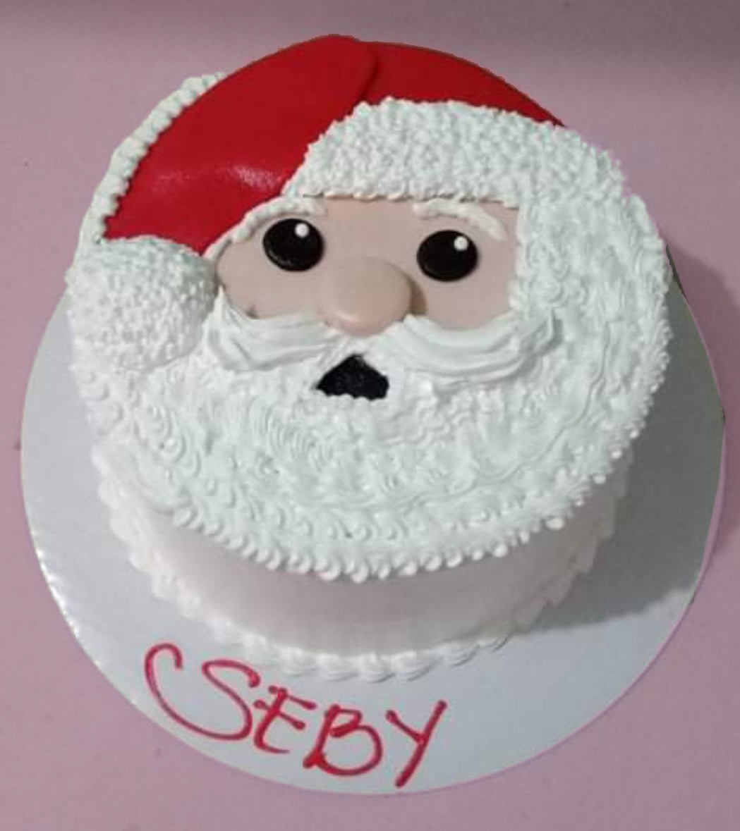 Christmas Cake With Merry Christmas Plate Holly Ornament Santa Claus Doll  Stock Photo - Download Image Now - iStock