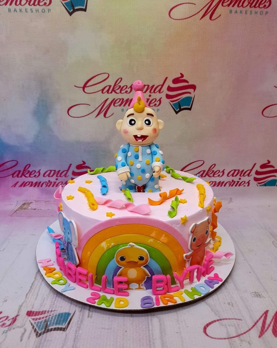 Cocomelon rainbow theme cake - Cake Nagar