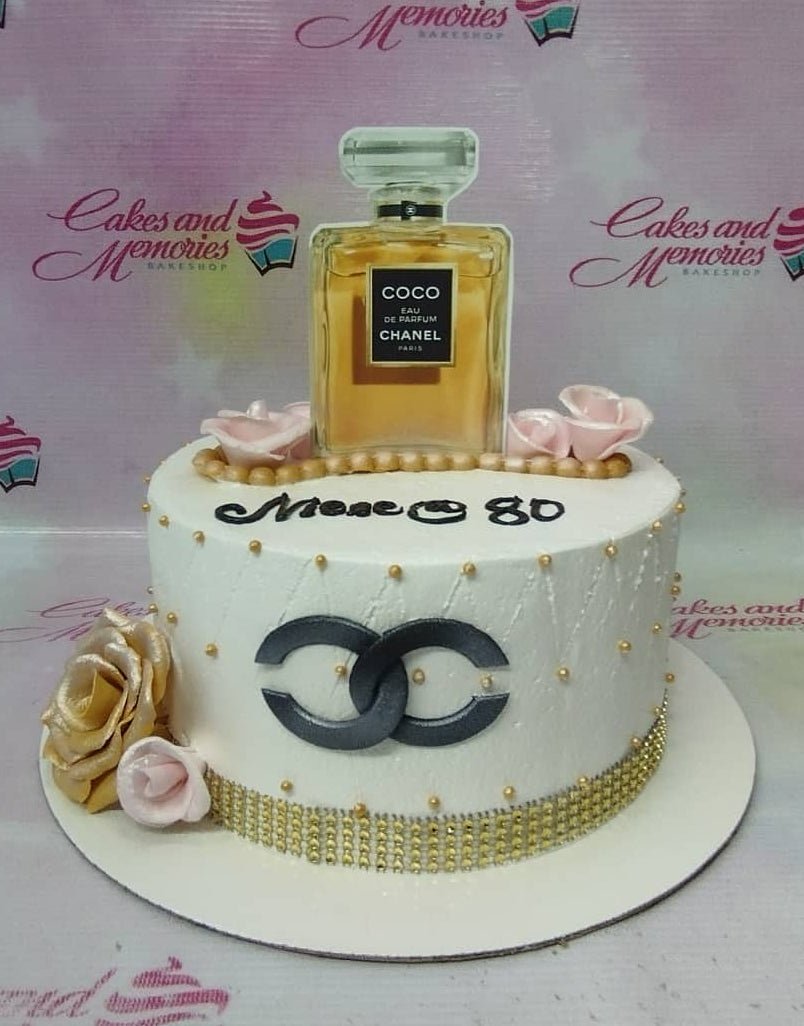 A perfume bottle cake and not just any perfume  its Chanel no 5   this Parisian beauty with fresh flowers and standing tall one   Instagram